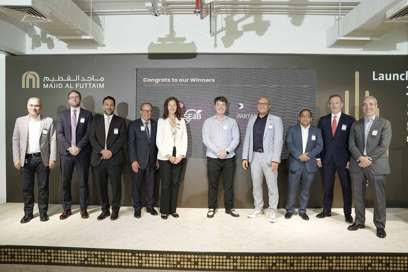 SEaB Energy team members photographed in front of Majid Al Futtaim Launchpad 2023 backdrop, including CEO - Sandra Sassow, and VP of Sales - Sean Brophy